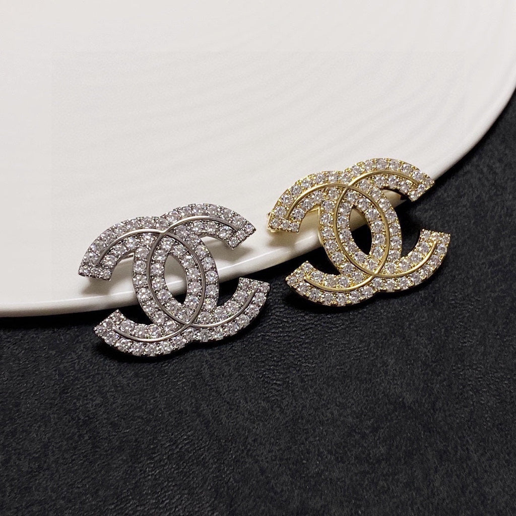18K  Chanel Diamonds Set Broochs